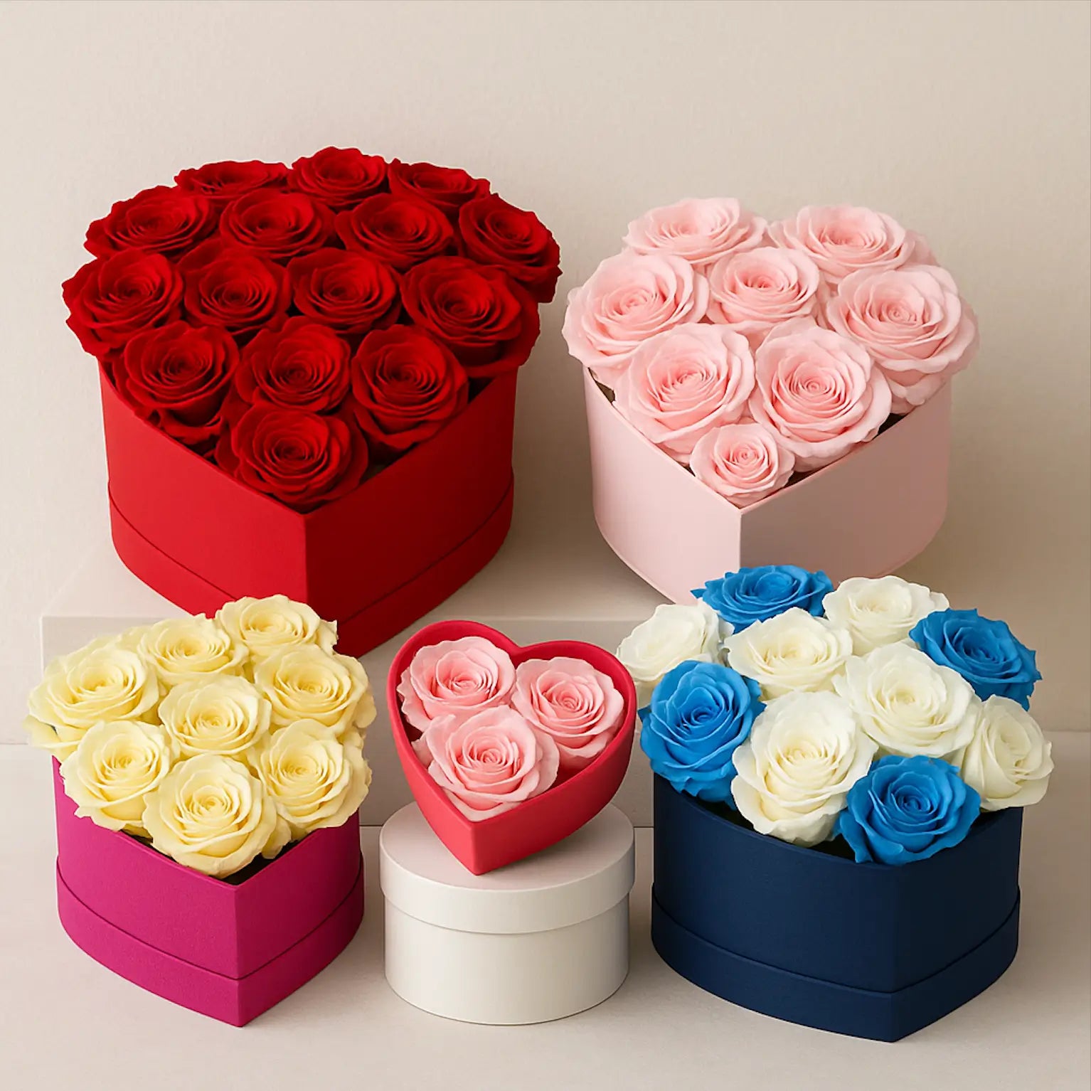 Heart-shaped flower boxes in various sizes and colors with tightly packed roses — red, pink, yellow, blue-white — Miami flower delivery