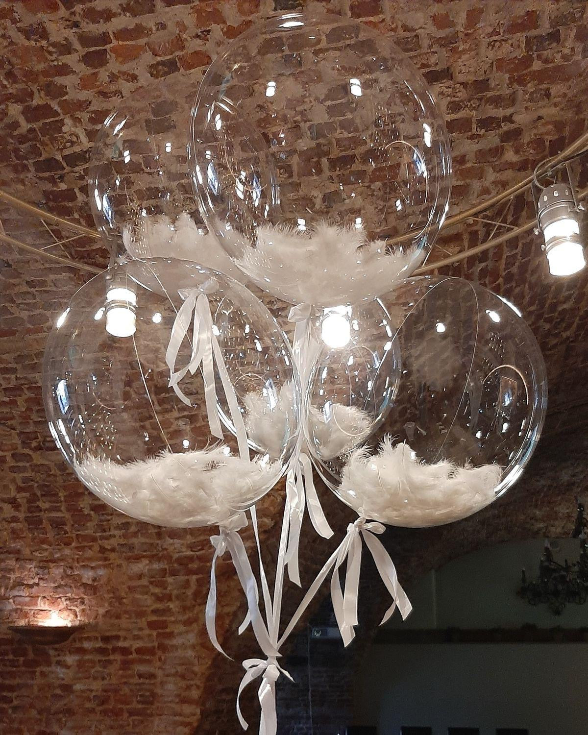 Transparent Feather Balloons: clear balloons, white feathers, satin ribbons in a balloon bouquet