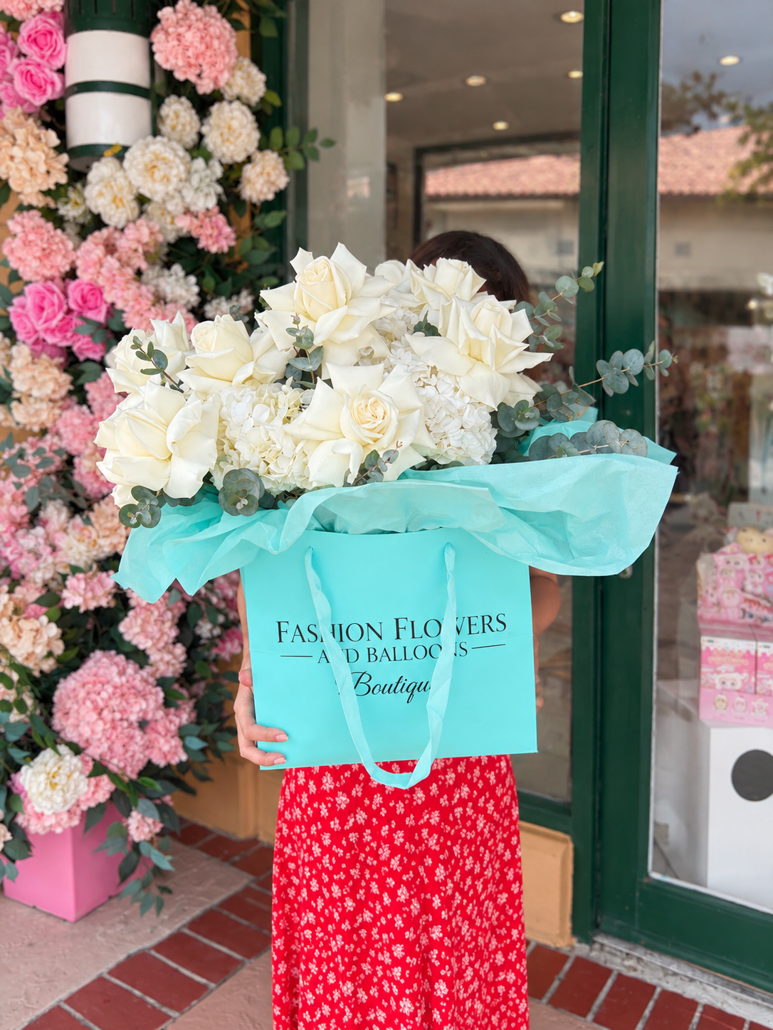 Flower Bag Arrangement of white roses, white hydrangeas, eucalyptus, seasonal greenery — Tiffany in Bloom