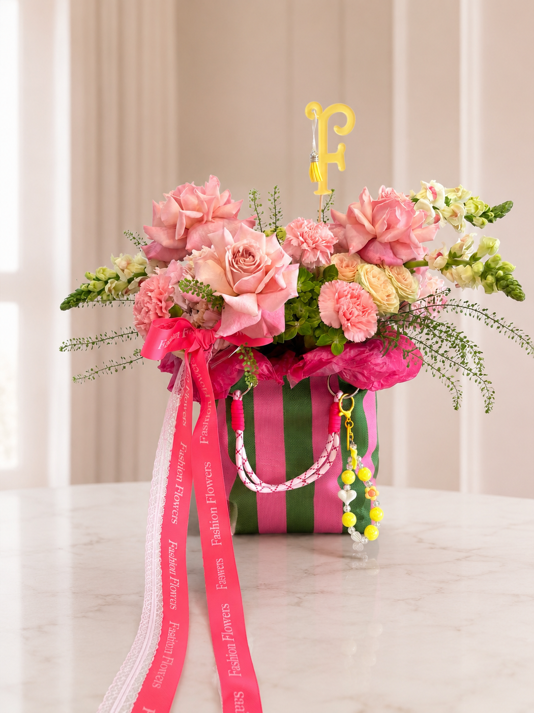 Glamour: fresh seasonal flowers, decorative charms, reusable bag in a flower bag arrangement