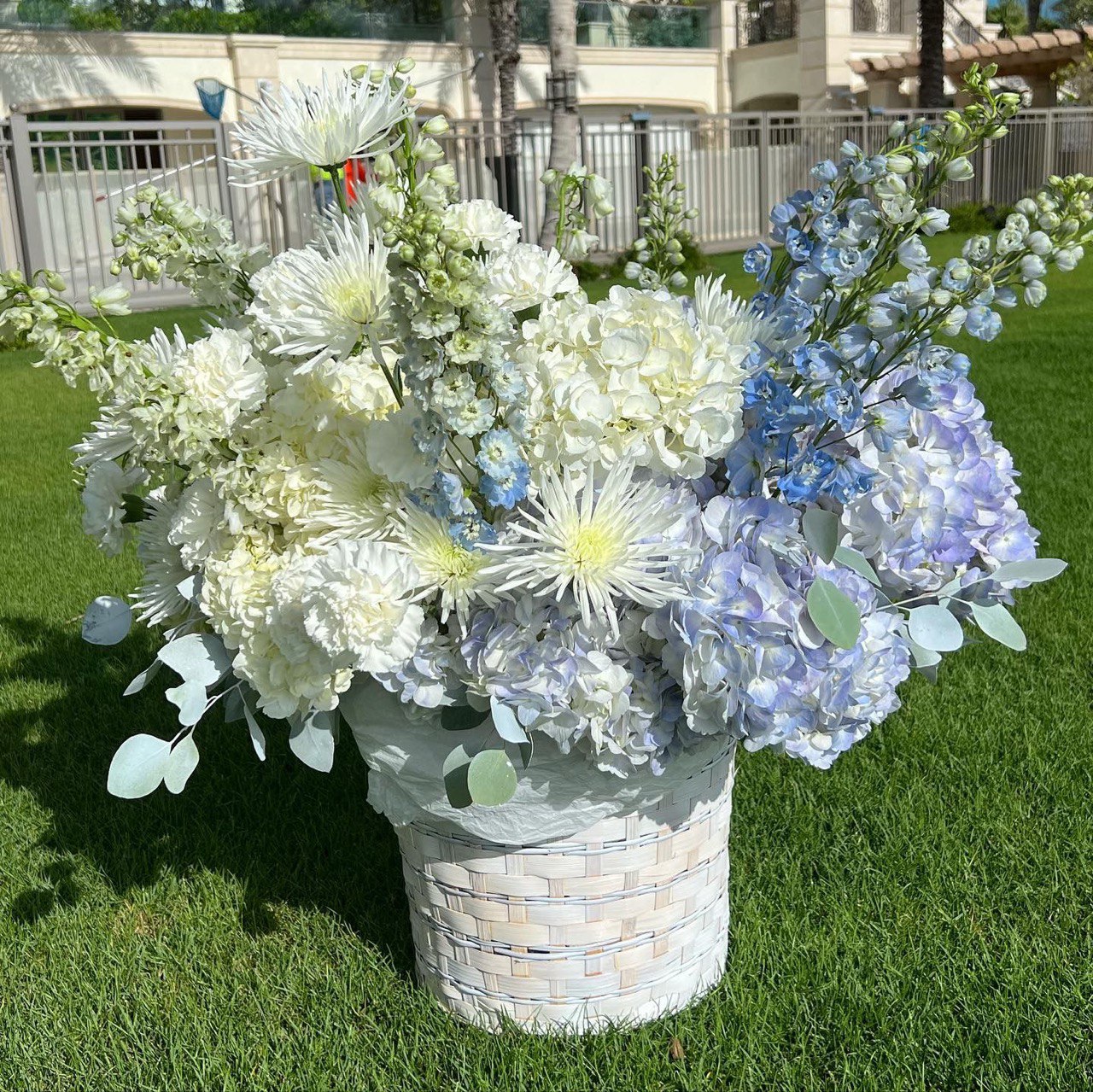 White and blue floral basket â luxury bouquet delivery Miami for elegant interiors