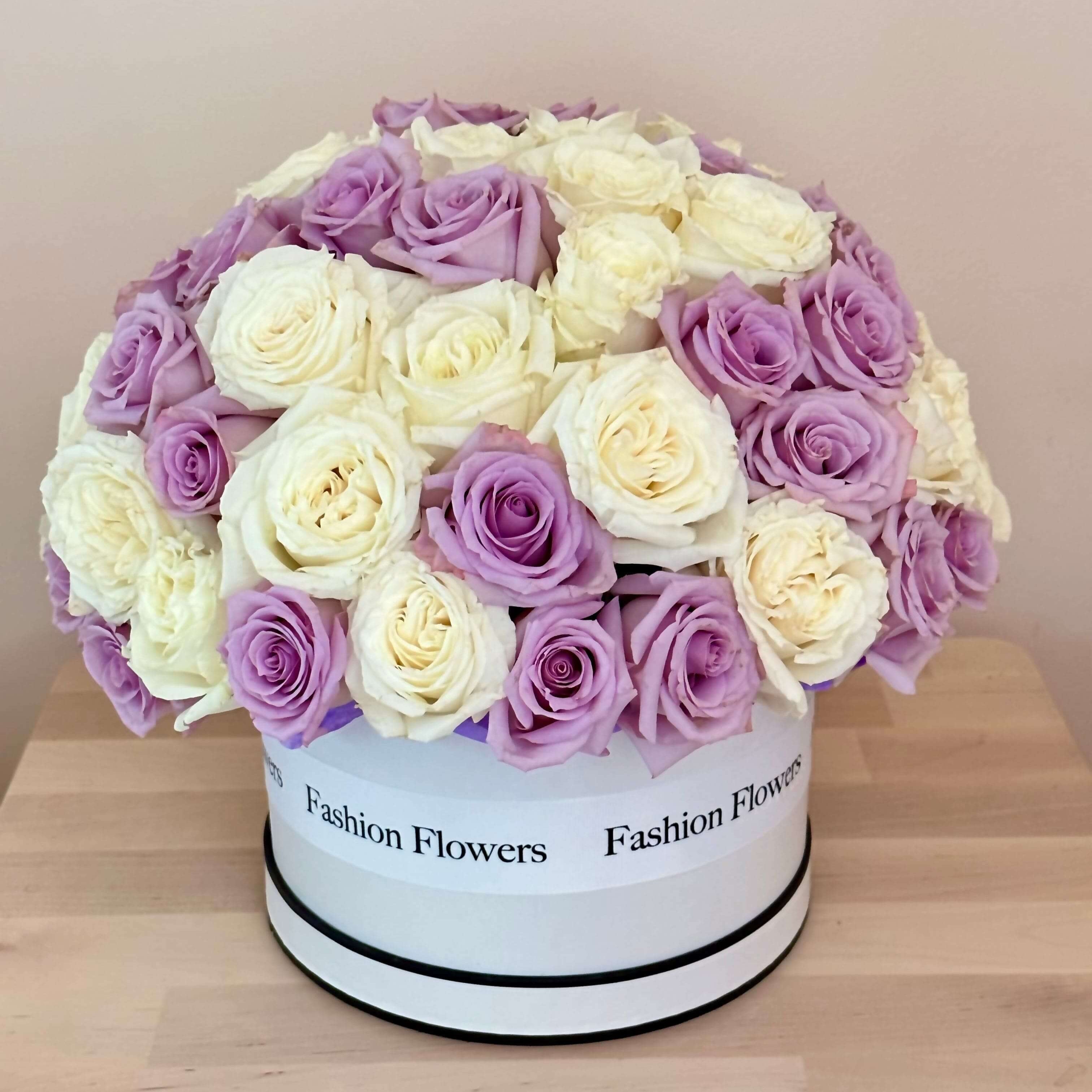 Blueberry Ice Cream floral arrangement of roses in a designer box â luxury flower delivery Miami