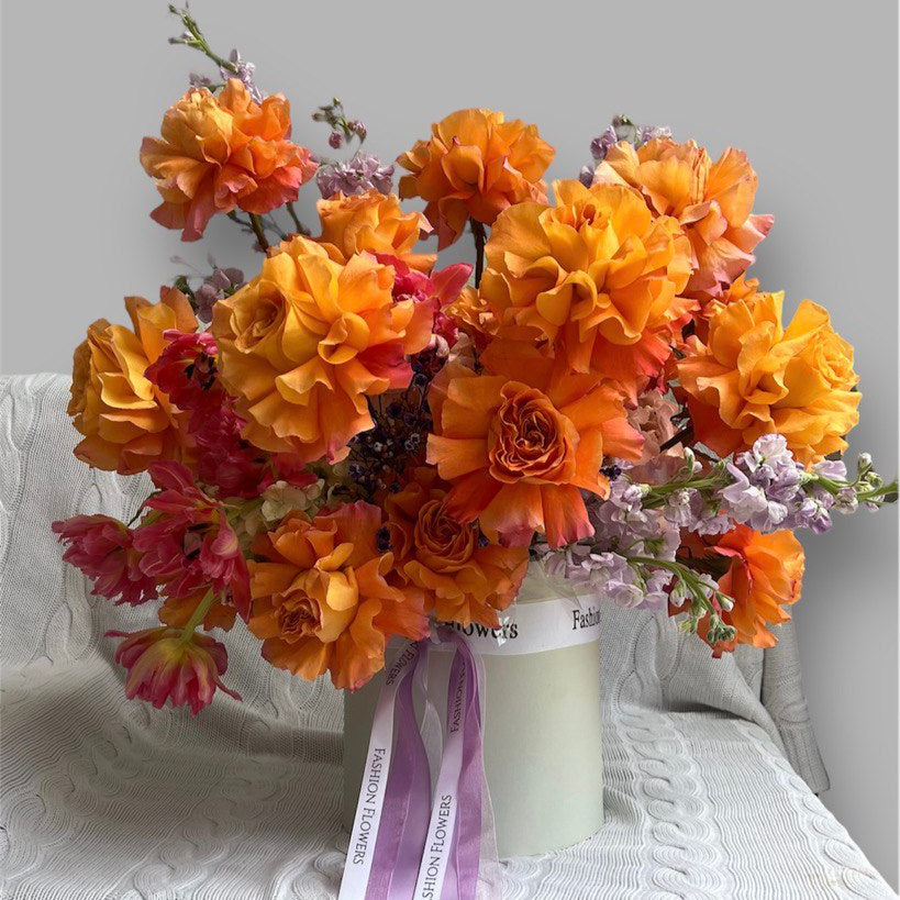 Luxury flower box "Flame of love" with orange roses – perfect for elegant gifting.