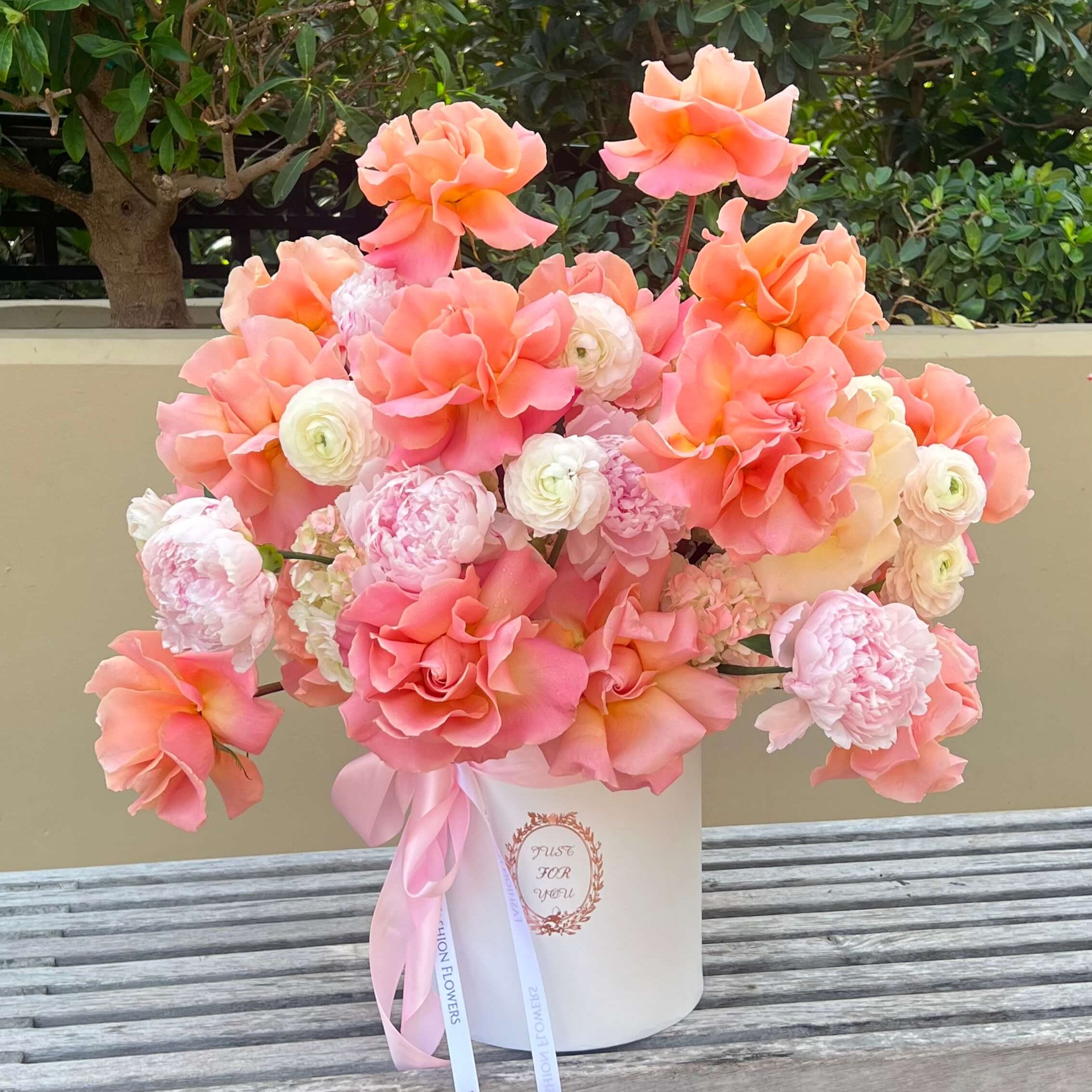 Coral pink flower box with peonies and roses — skyline flower delivery Miami