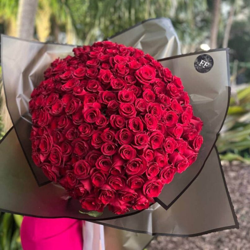 Luxury bouquet with 150 red roses in dark wrapping â passionate flower delivery Miami