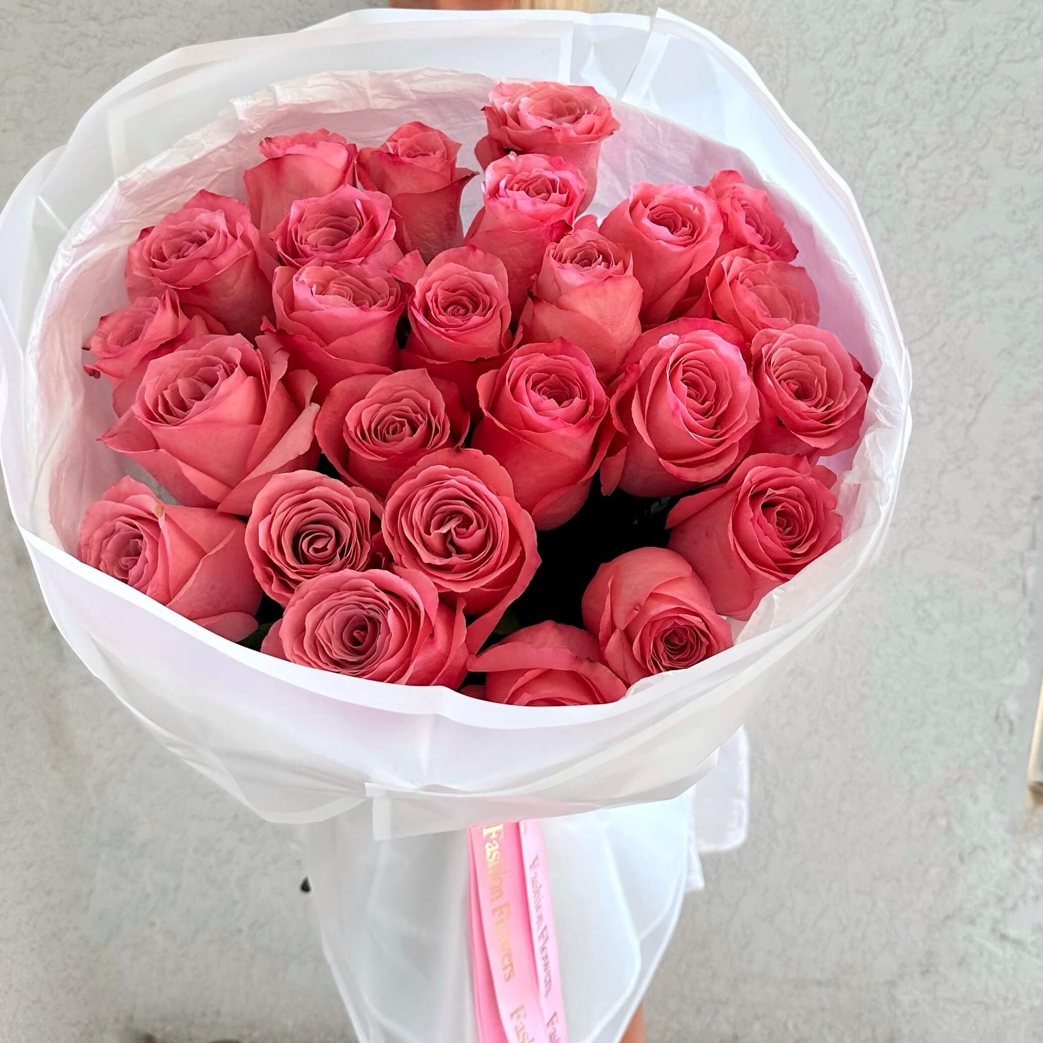 Just Pink Roses hand-tied bouquet with long stem bright pink roses in white wrap â luxury flower delivery Miami