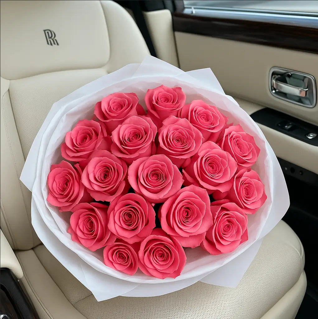 Just Pink Roses bouquet in white wrap with smiling woman inside Rolls-Royce â romantic flower delivery Miami