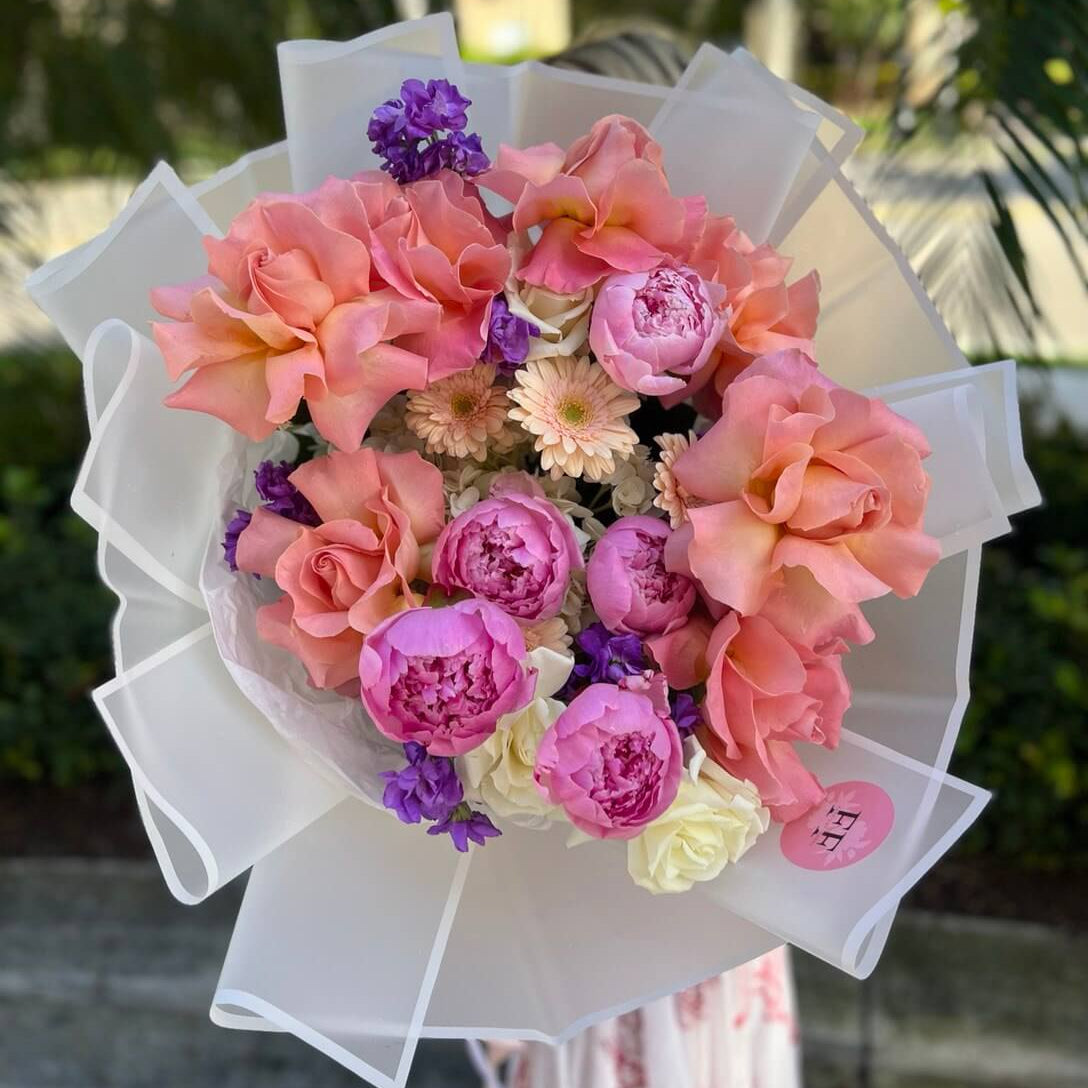Luxury hand-tied bouquet “Magic Waltz” with pink peonies and roses white wrap — same-day flower delivery in Miami