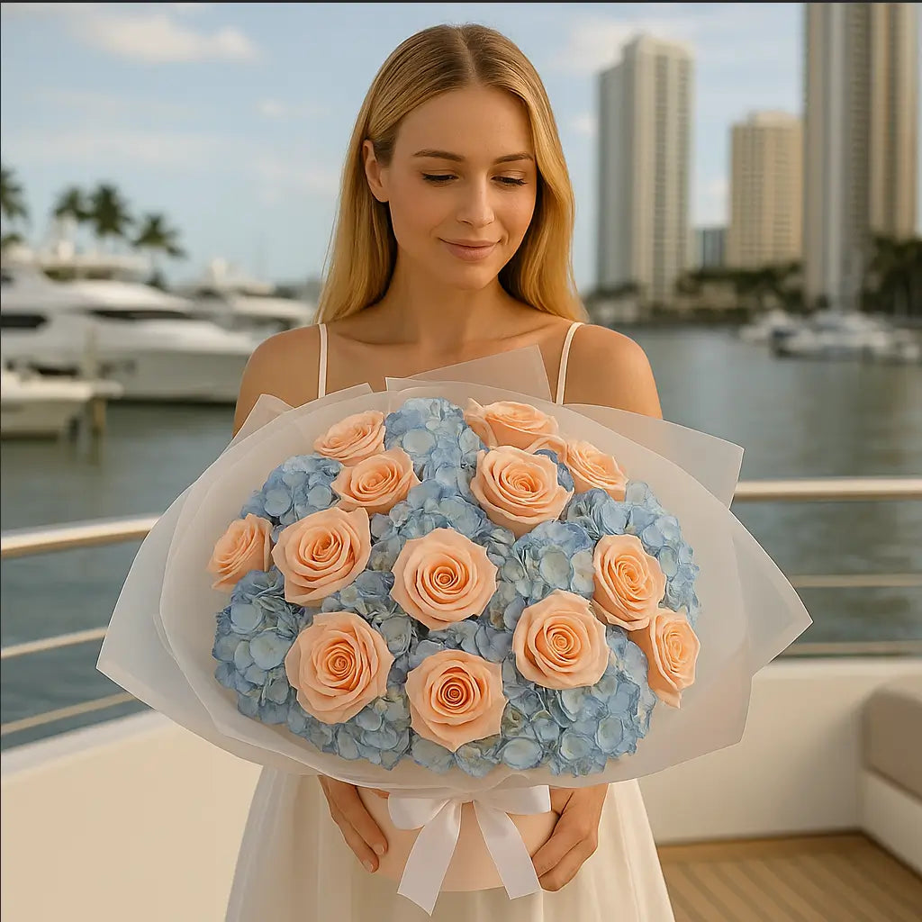 Marshmallow bouquet with dozens of small peach roses and blue hydrangeas — luxury floral delivery Miami