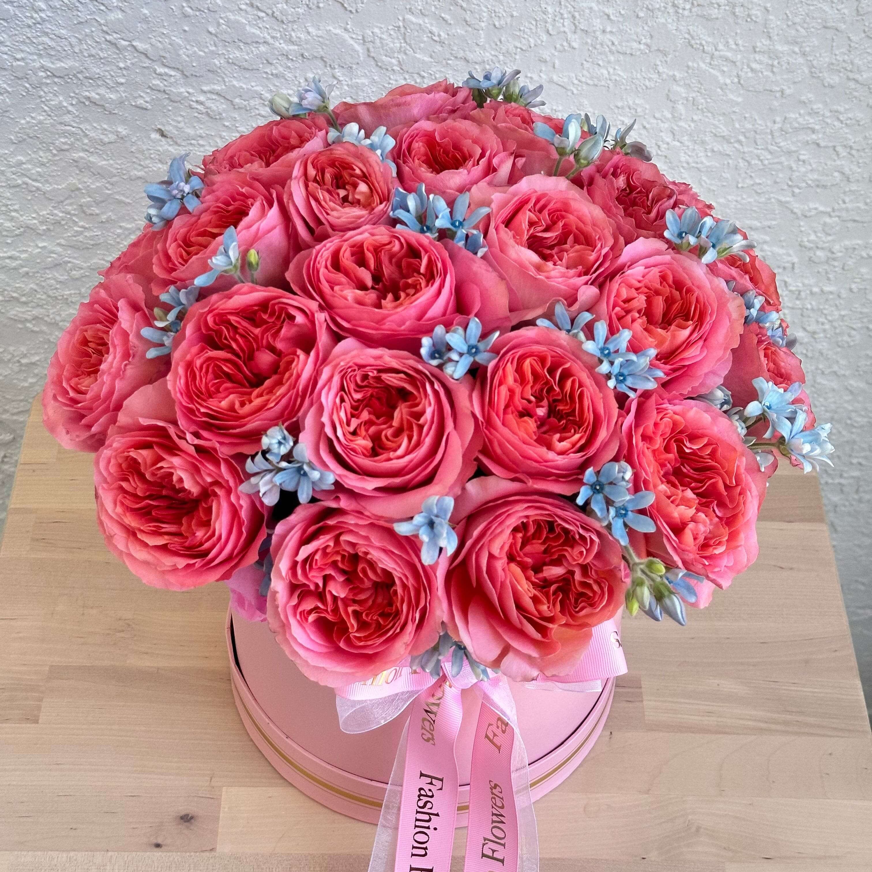 Mona Lisa bouquet of soft pink roses and blue flowers with satin ribbon wrap â luxury floral gift Miami