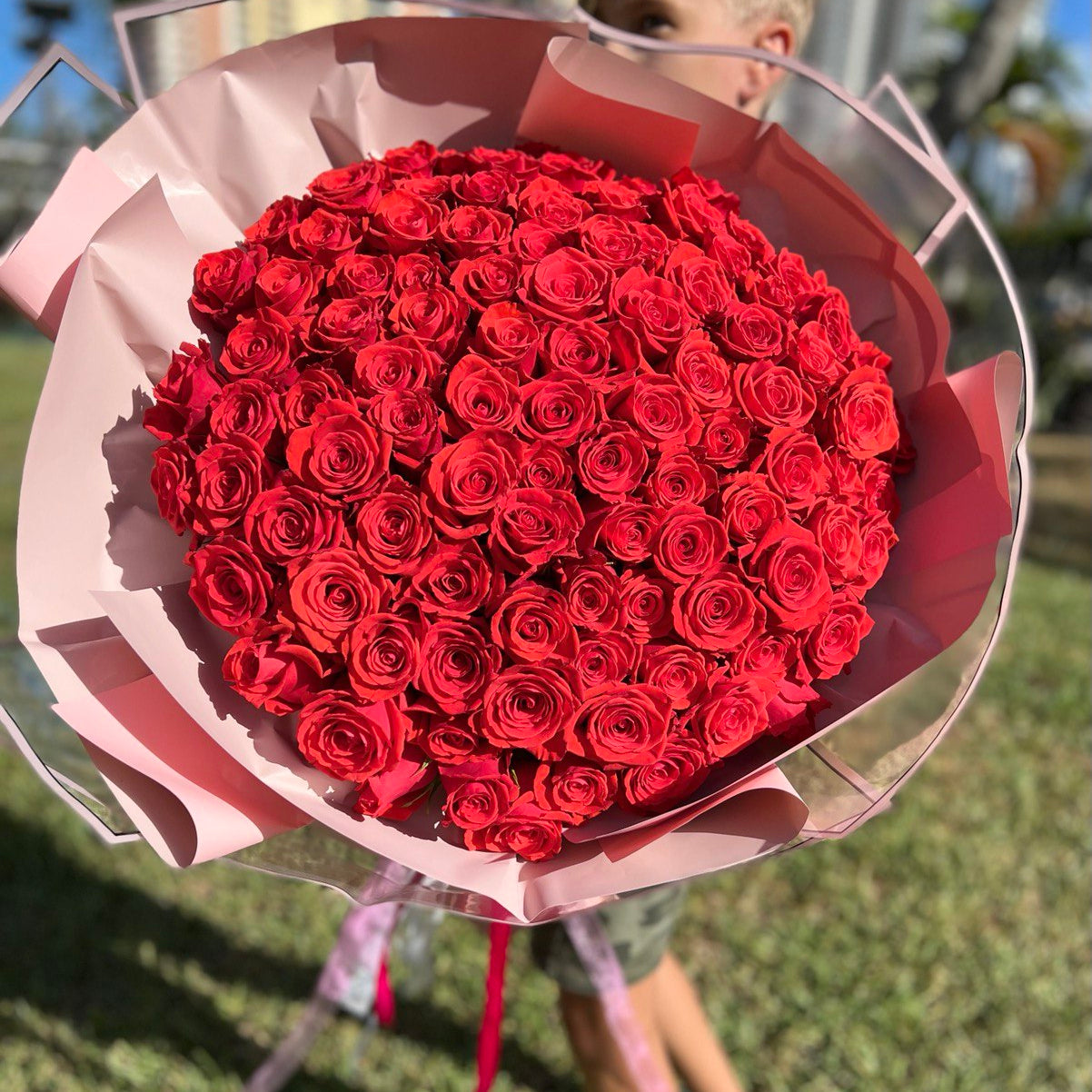 Nina bouquet of 100 red roses wrapped in pink â Miami