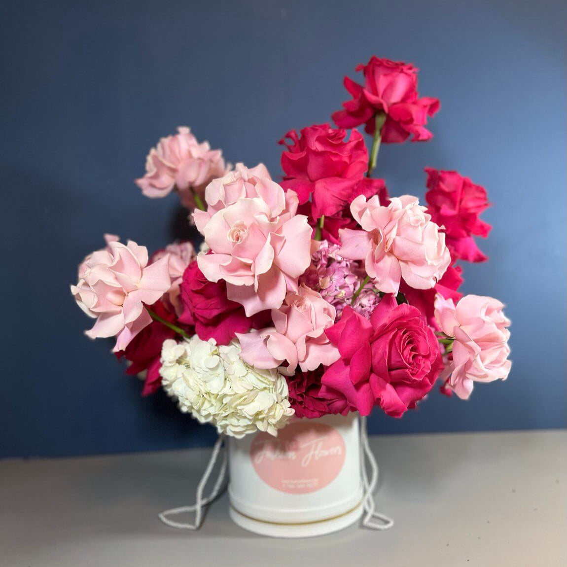 Elegant flower box “Pink Expression” with soft pink and bold roses — luxury flower delivery Miami