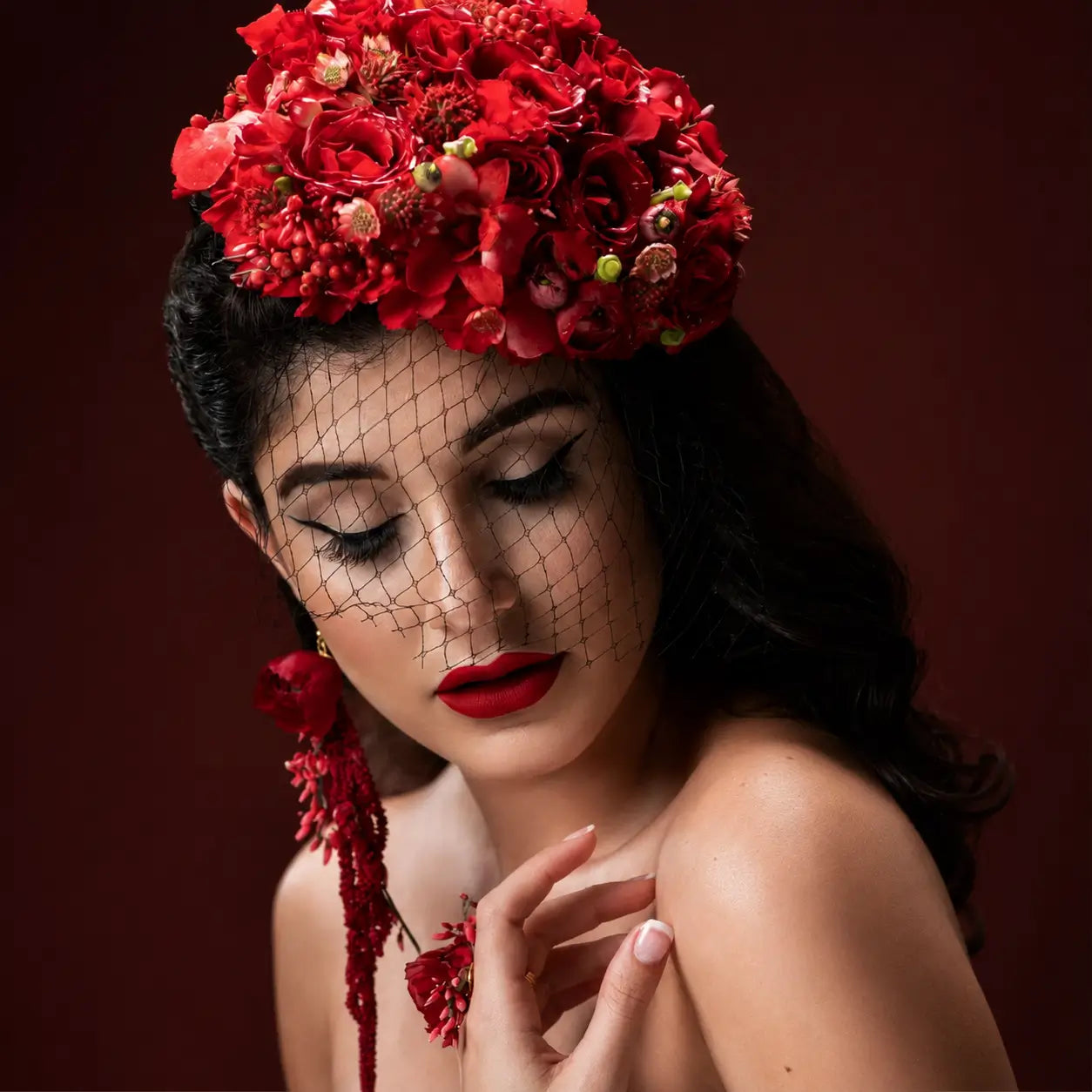 Editorial portrait of Red Flame wearable floral artwork with red floral crown designed by Miami Flower Delivery.
