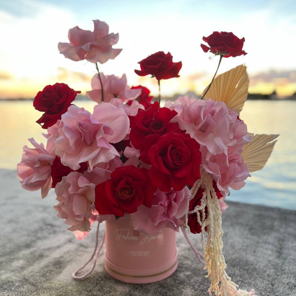 Beautiful Flamingo flower box with red and blush roses â luxury flower delivery in Miami with artistic designer touch