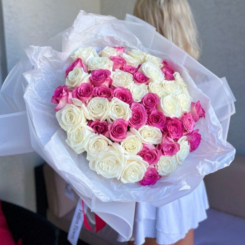 Luxury bouquet of 100 white and pink roses with white wrapping and pink ribbon — same-day flower delivery in Miami
