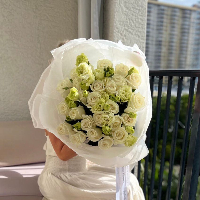 Snowy Serenity hand-tied bouquet with white roses and green buds in white wrap — flower delivery Miami