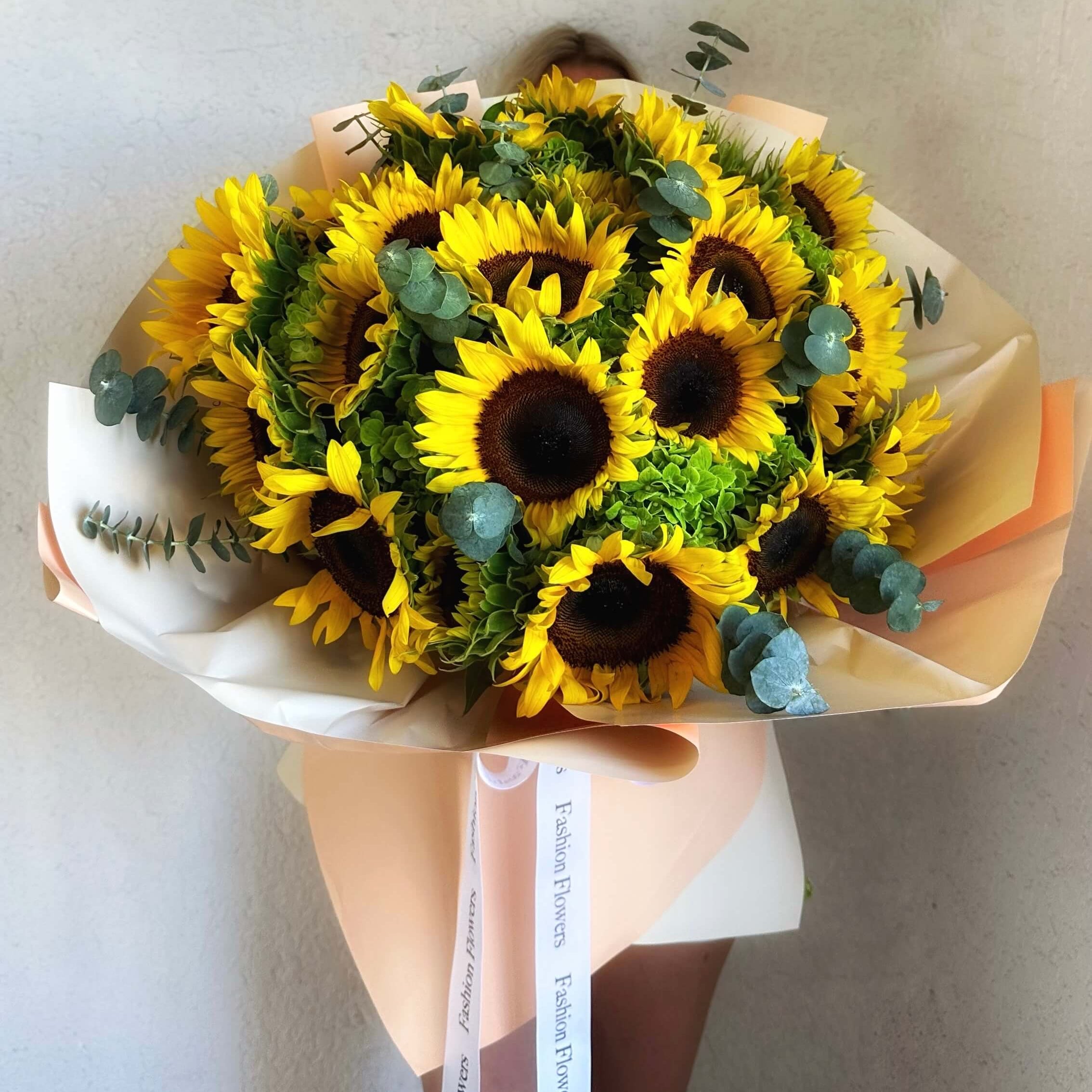 Sunflower Lover hand-tied bouquet with eucalyptus, white and yellow wrap â flower delivery Miami