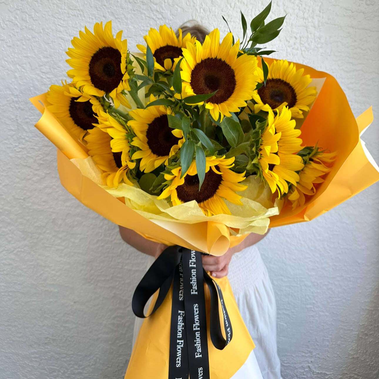 Sunny Delight bouquet with decorative sunflowers and yellow wrap â luxury flower delivery Miami