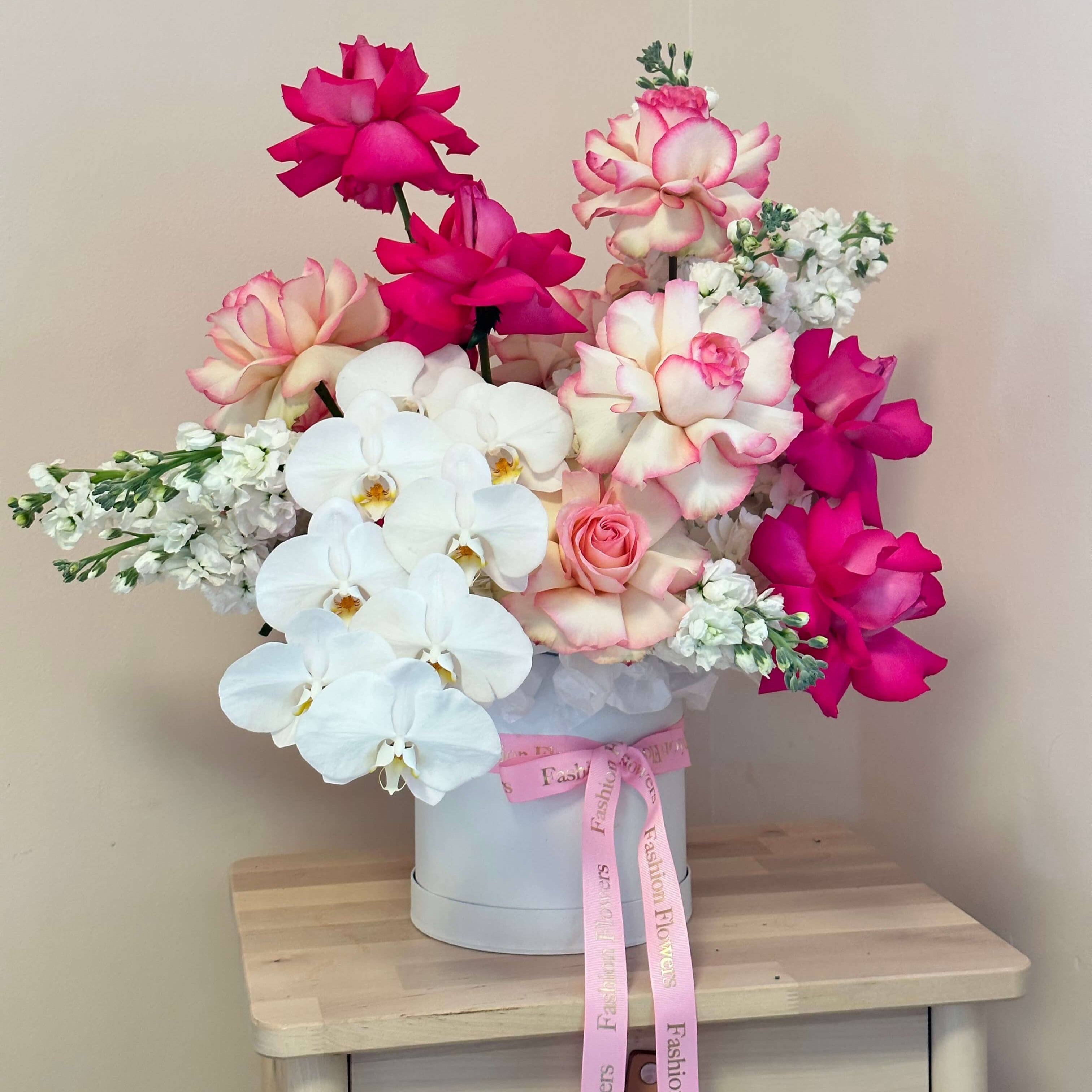 Swan Lake floral arrangement with orchids and roses in designer box — premium flower delivery Miami