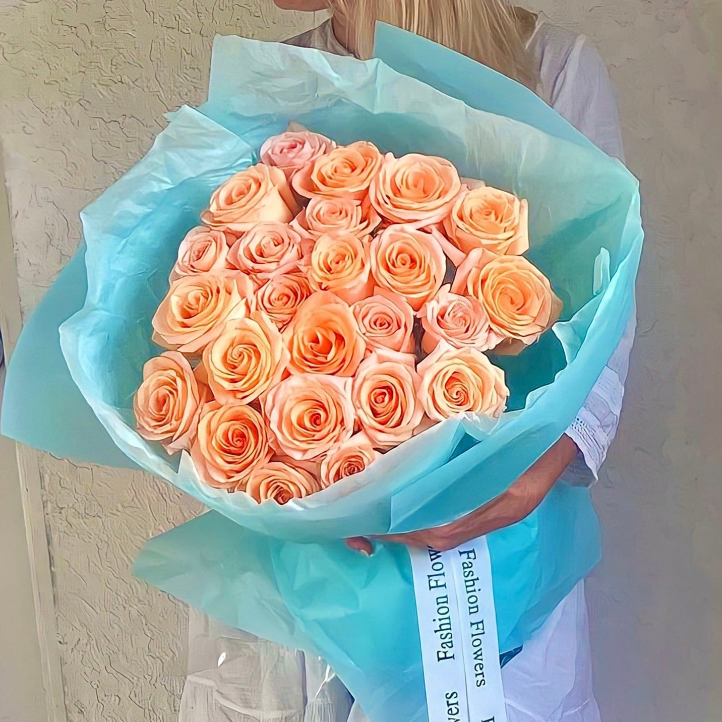 Luxury bouquet of peach roses in bright turquoise paper â same-day flower delivery in Miami
