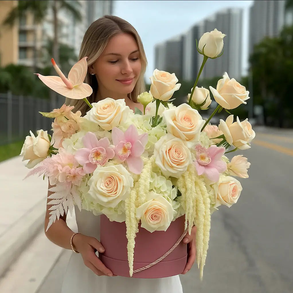 Large pink designer box with white hydrangeas, blush roses, orchids — luxury flower delivery in Miami
