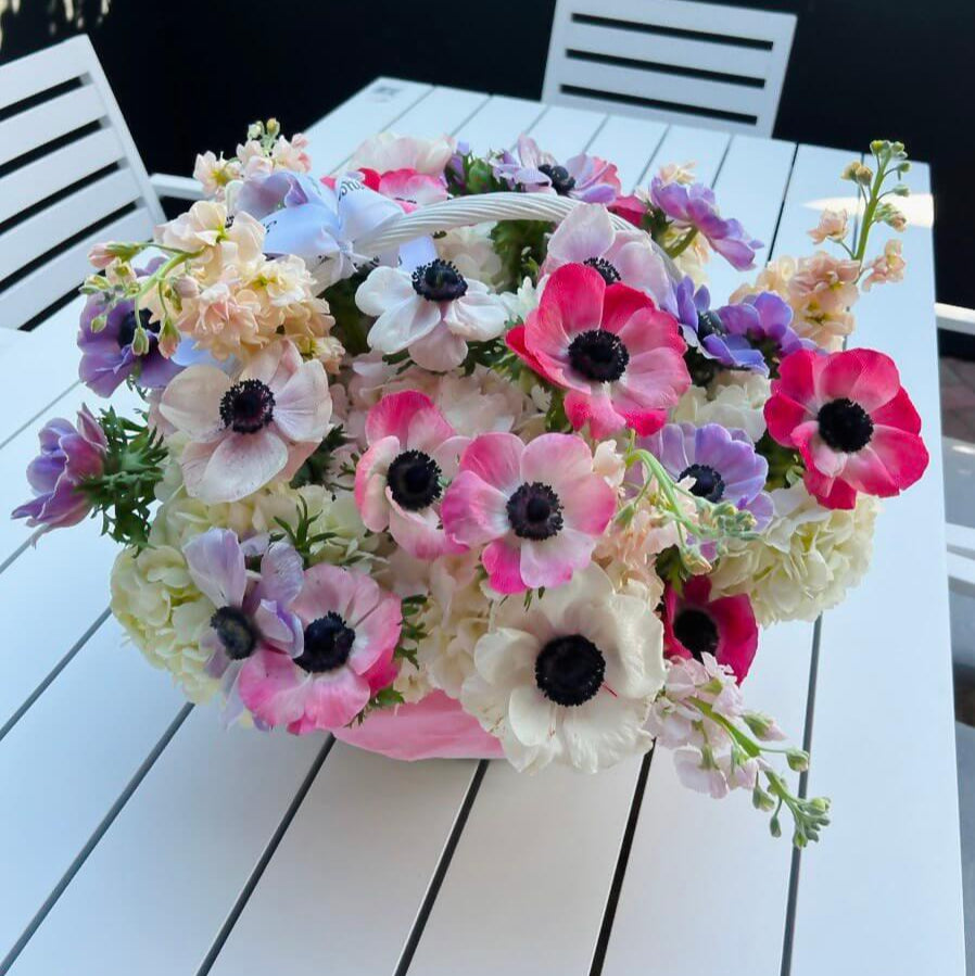 Soft pink and lavender floral basket with anemones and hydrangeas — luxury Miami delivery