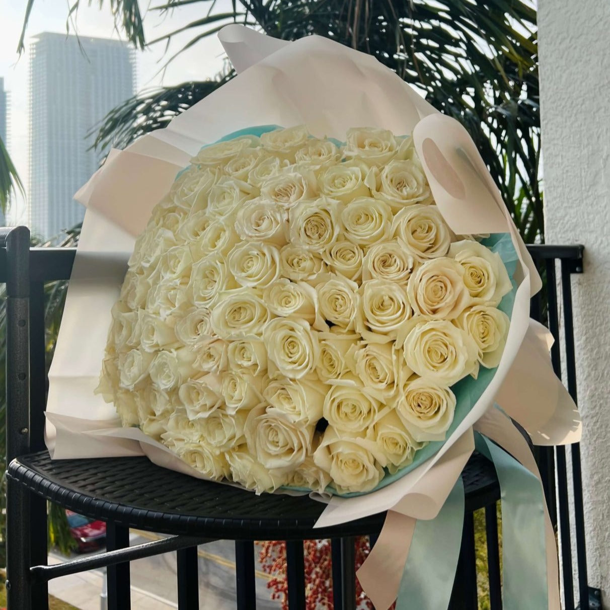 Elegant bouquet of 200 white roses in pure white wrap with ribbon â luxury flower delivery in Miami