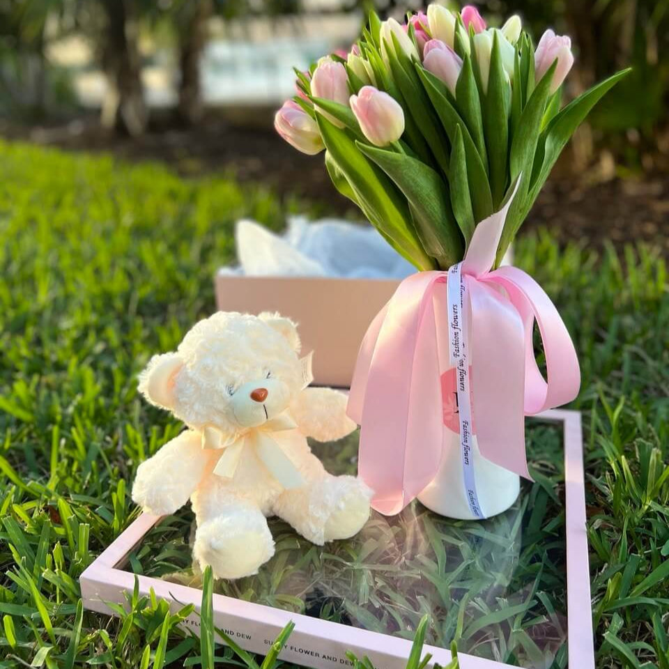 Elegant gift box with tulips in vase, white teddy and satin ribbon — perfect romantic surprise without any text or branding