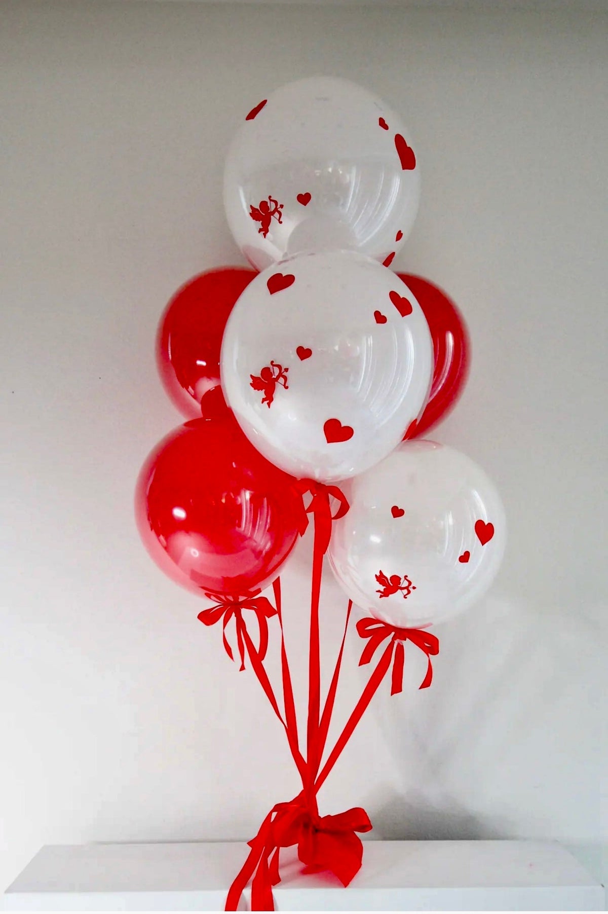 Hearts & Cupid: red and white balloons, heart and cupid prints in a romantic balloon bouquet
