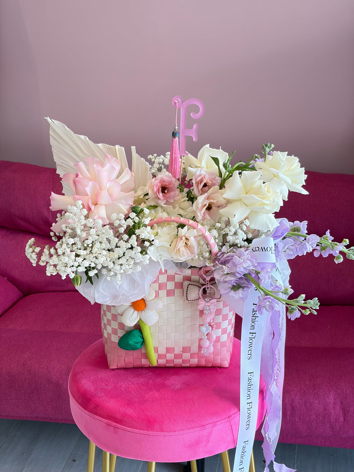 Angel Cloud: fresh seasonal flowers, ribbons, decorative charms in a flower bag arrangement