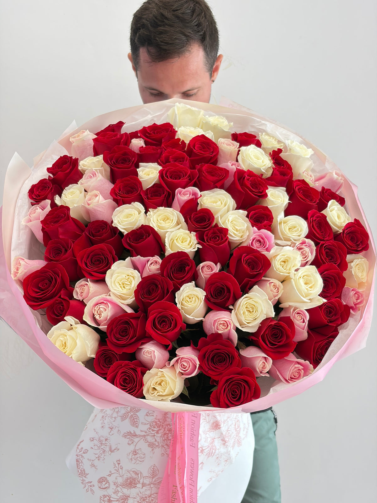 Signature Love Mix: red roses, pink roses, white roses in a hand-tied bouquet