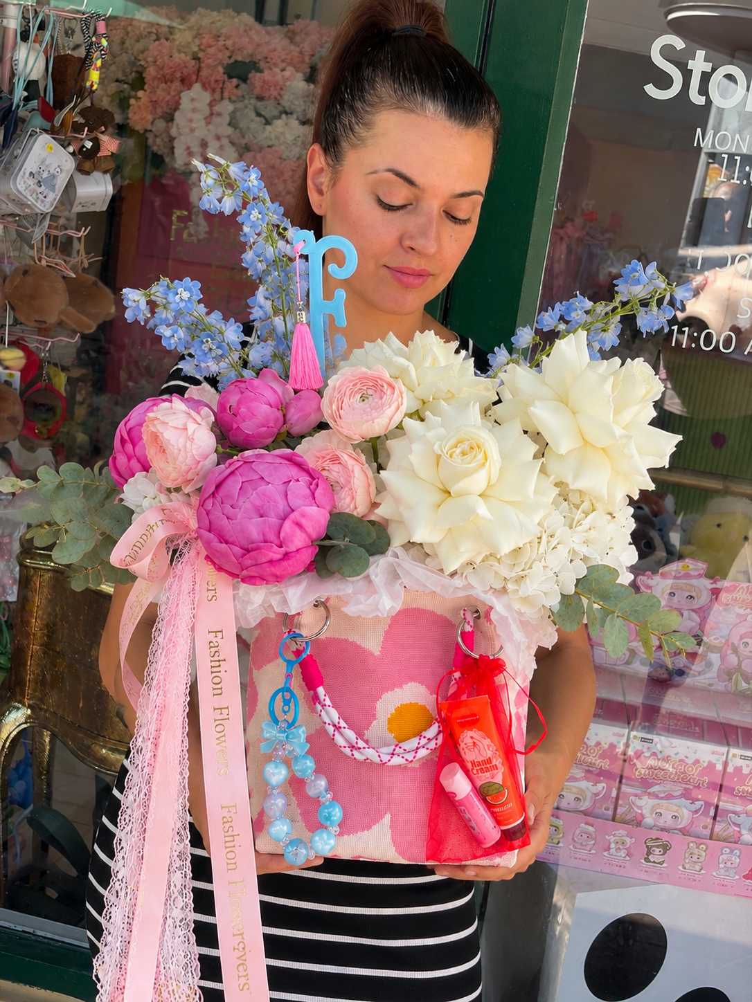Flower Bag Arrangement of white roses, hydrangeas, pink blooms, eucalyptus, blue accents — Pretty Little Things