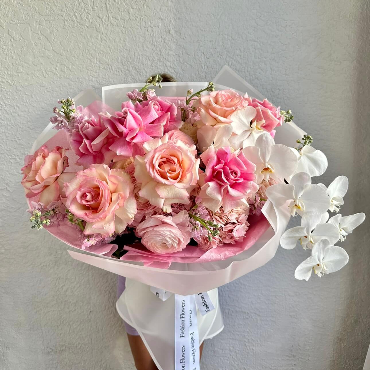 Pastel bouquet of roses and orchids — premium same-day flower delivery in Miami