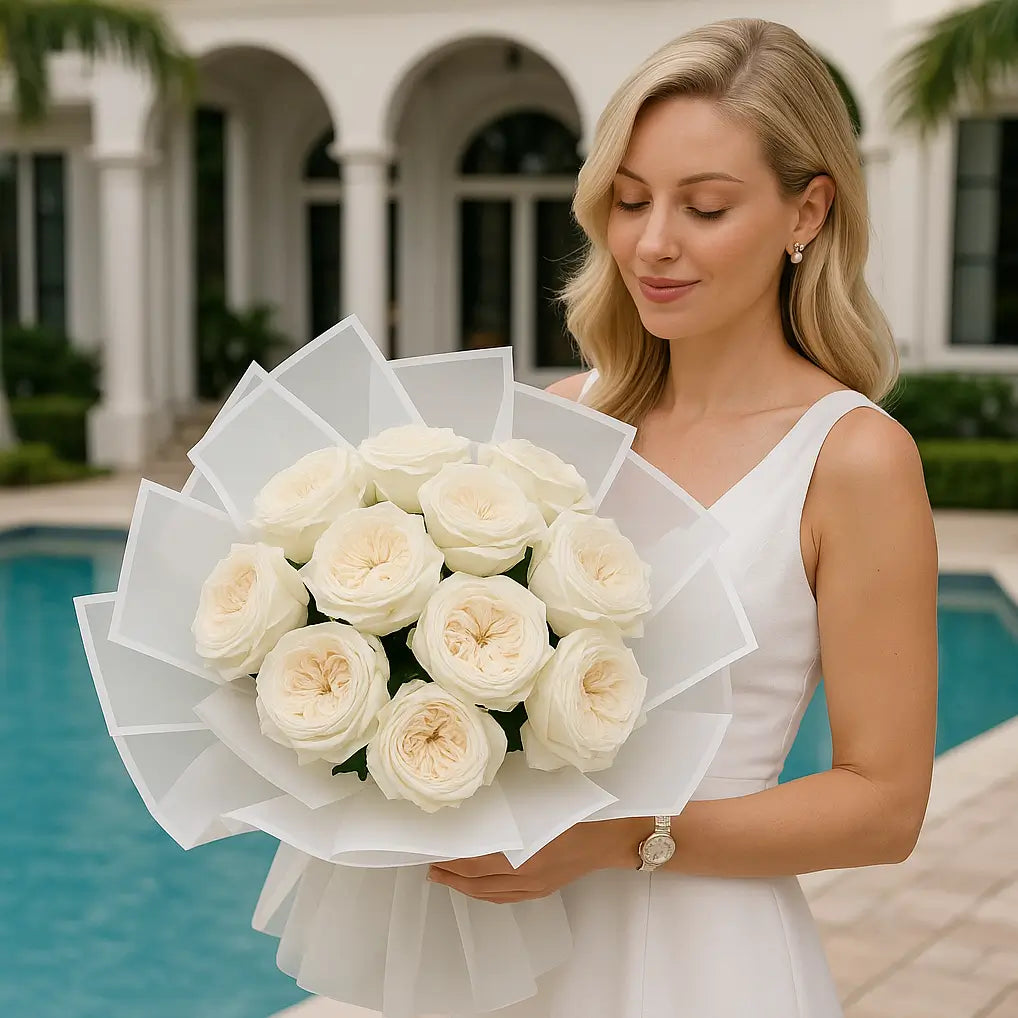 Divine Fragrance in white hand-tied bouquet with cream roses — luxury flower delivery Miami by the pool at elegant villa