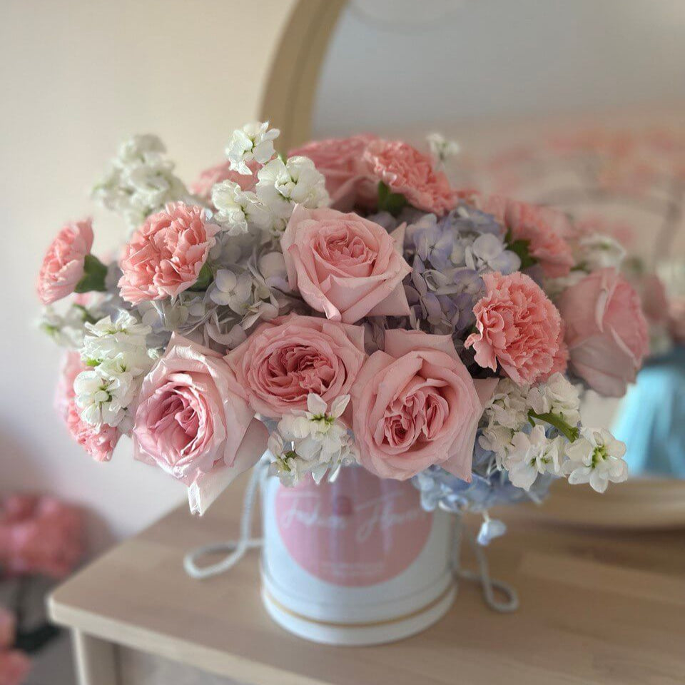Gentle Kiss white hatbox with soft pink roses and blue hydrangeas - luxury flower delivery Miami