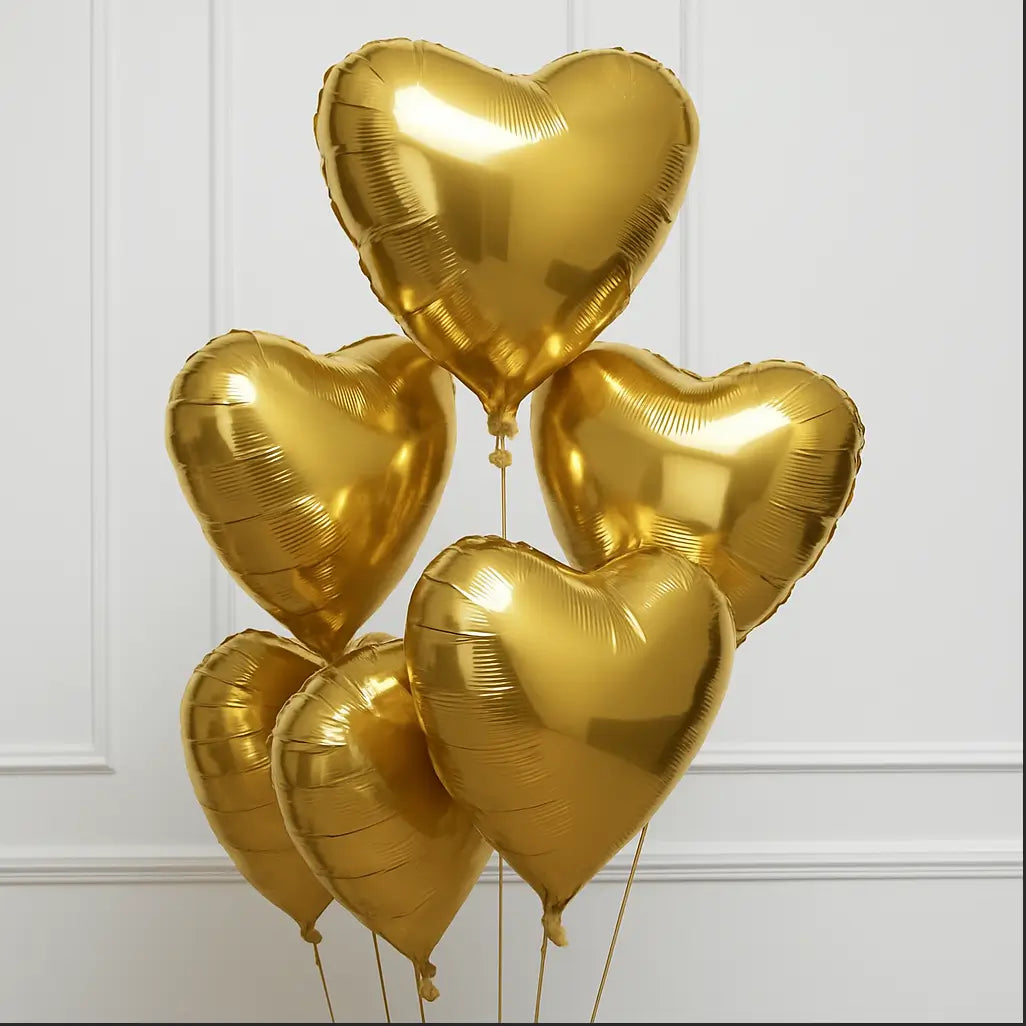 Elegant heart-shaped gold foil balloons in various sizes — perfect for luxury romantic decor