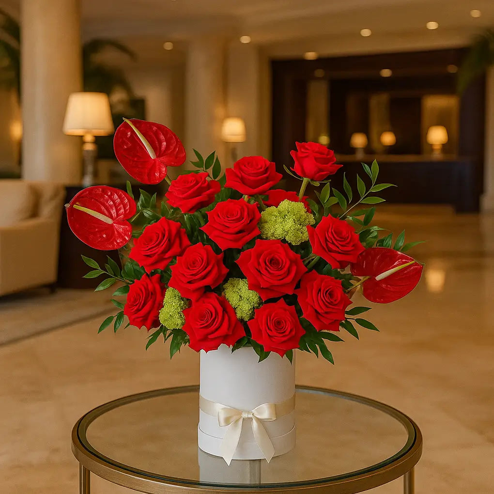 Kiss Me red rose and anthurium luxury box arrangement in hotel lounge — premium flower delivery Miami