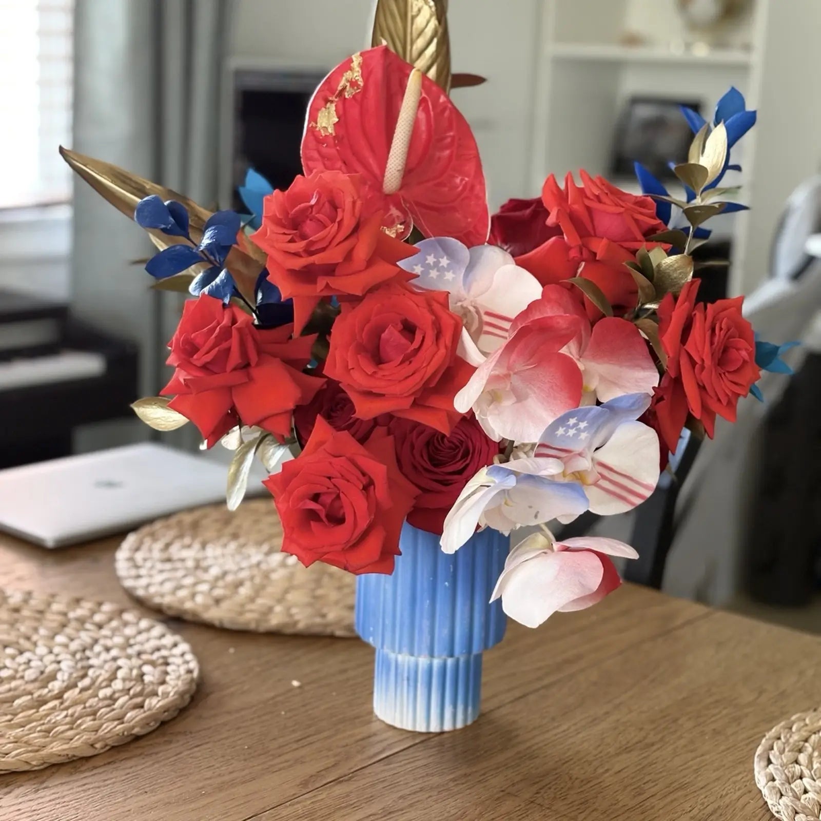 Luxury patriotic floral arrangement with red roses, white orchids and gold foliage handcrafted by Miami Flower Delivery