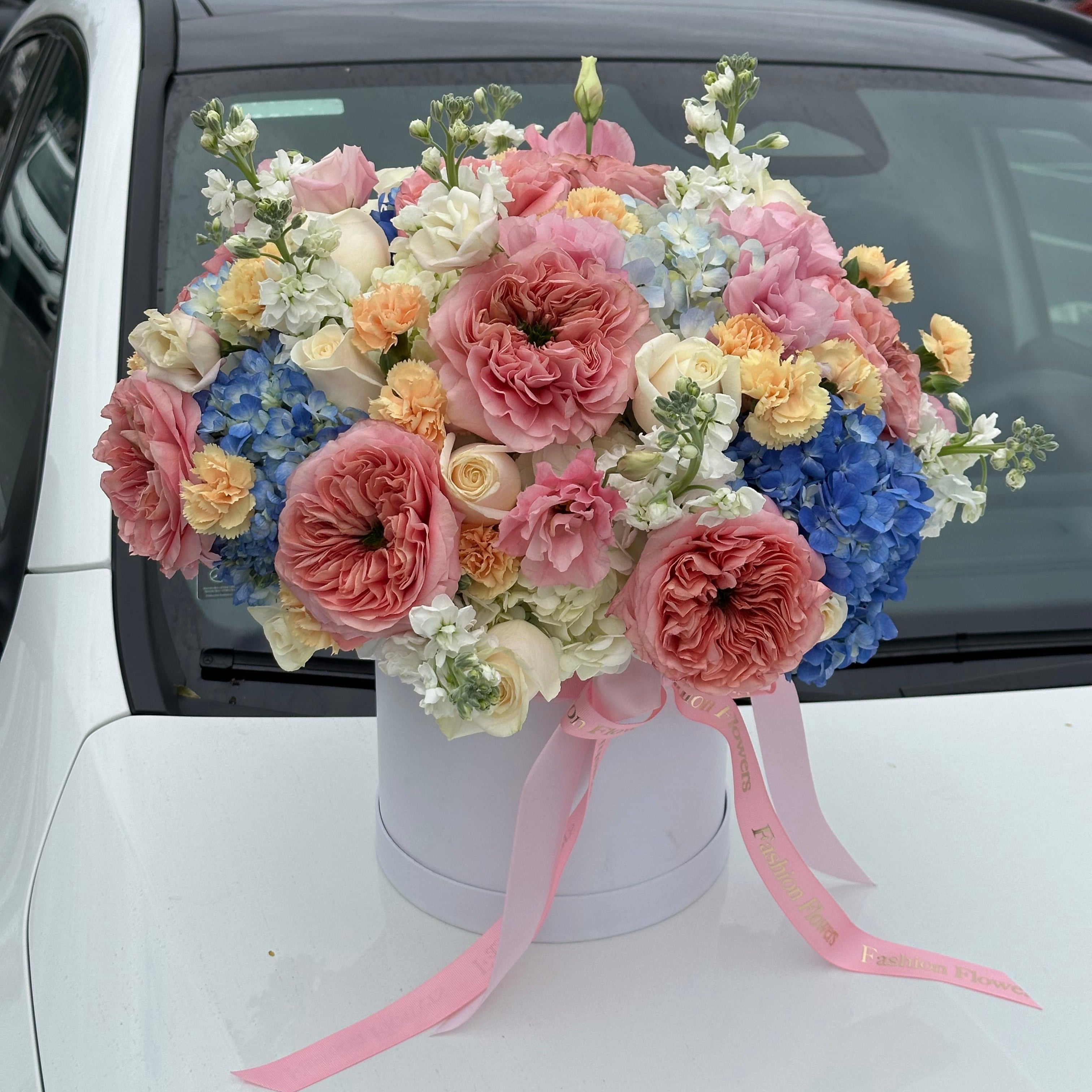 Perfect Bloom designer box with pastel garden roses and blue hydrangeas — luxury flower delivery Miami