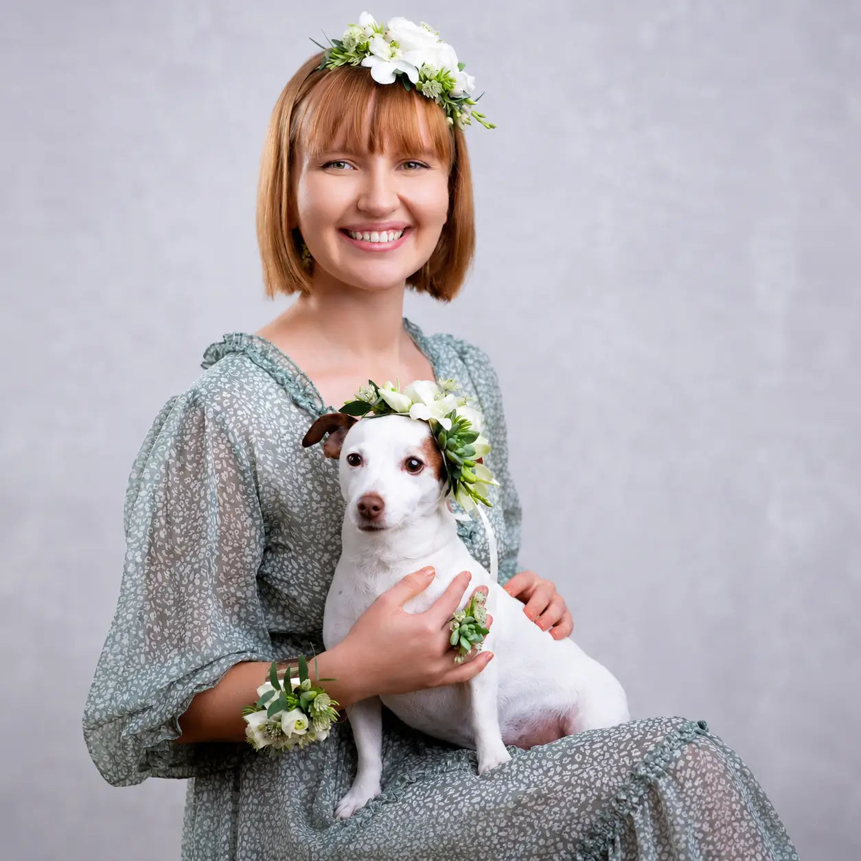 Pets Are Our Family™ wearable floral art featuring a woman and her dog adorned with handcrafted floral accessories by Miami Flower Delivery