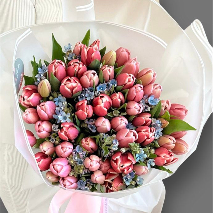 ink and Blue Serenity tulip bouquet with white wrap and soft ribbon — luxury flower delivery in Miami marina