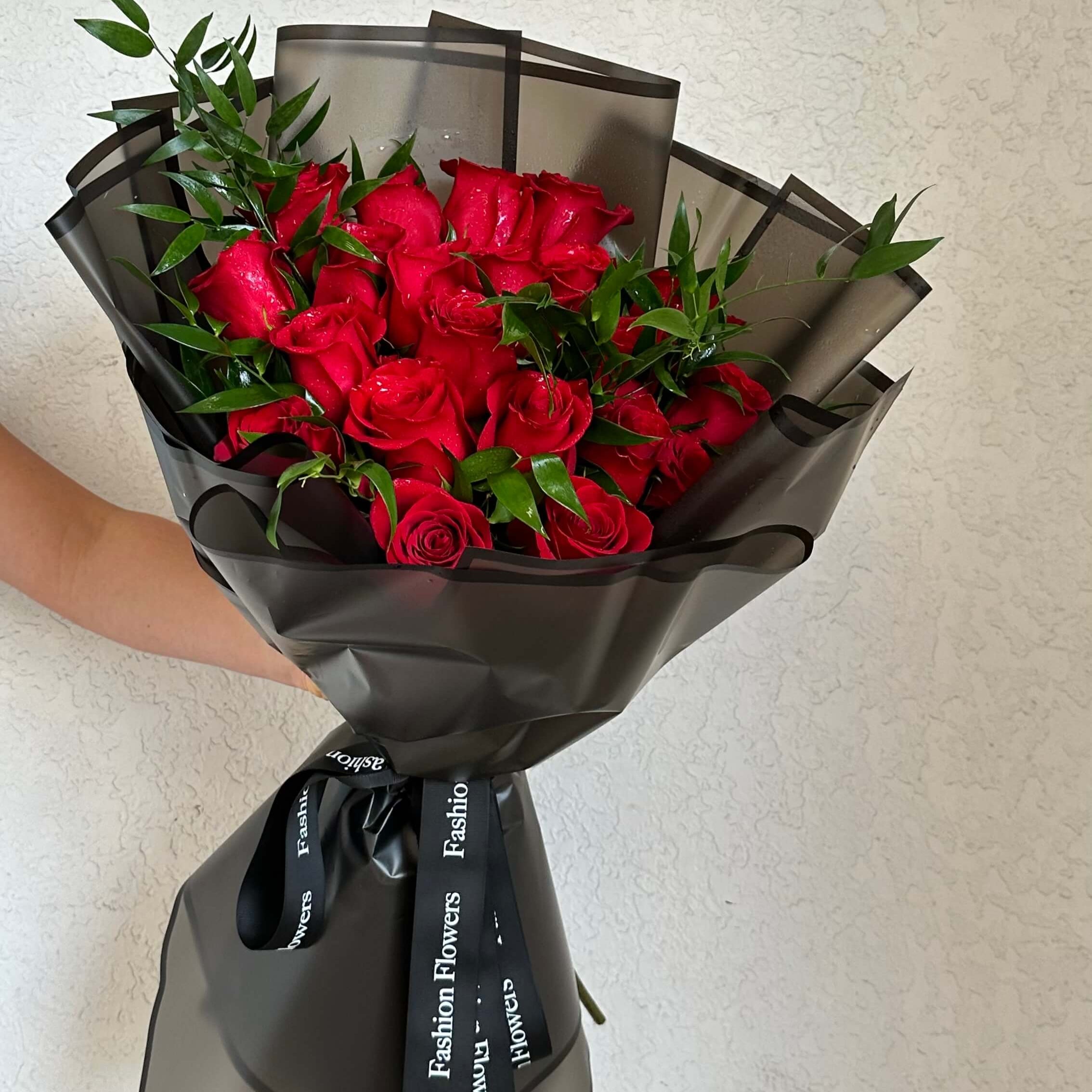 Red Cascade hand-tied bouquet with red roses in black wrap — flower delivery Miami