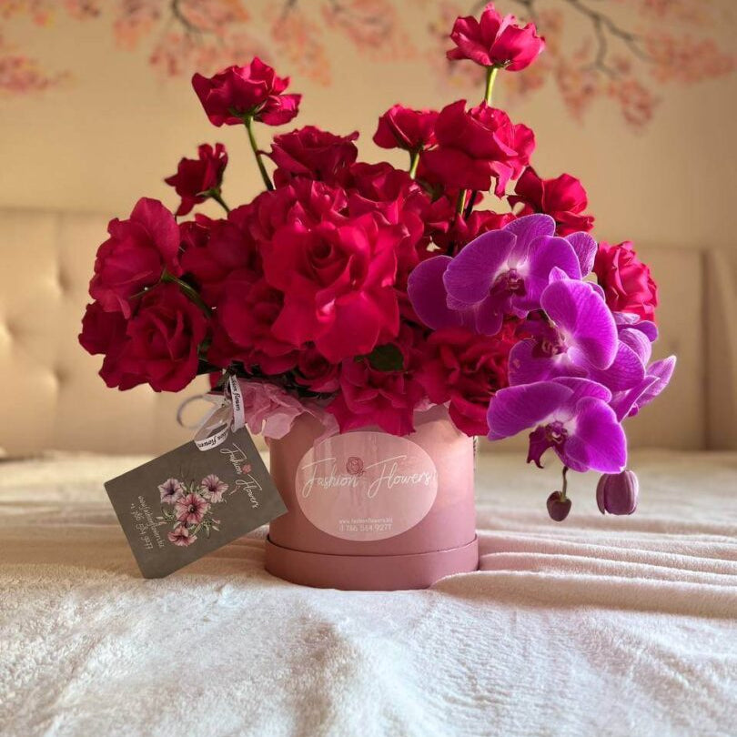 Sweet cherry roses and orchids in a pink box— luxury flower delivery in Miami, same-day