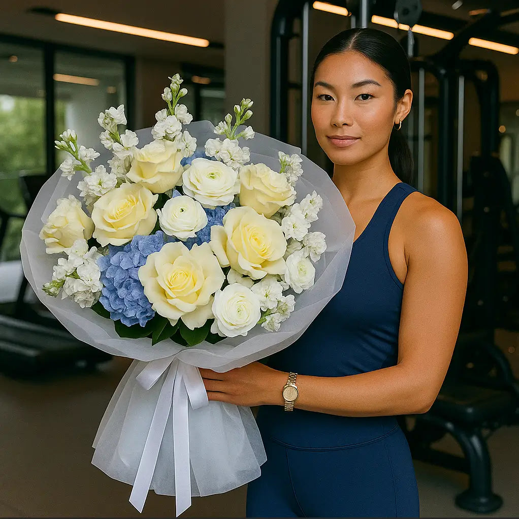 Waves of Tenderness bouquet with white roses, blue hydrangeas, ranunculus and stock — luxury flower gift for unforgettable moments