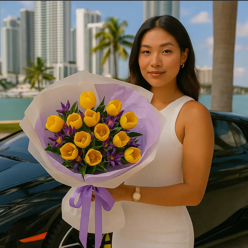 Yellow tulip bouquet with purple accents in white and lavender wrap — luxury same-day flower delivery Miami